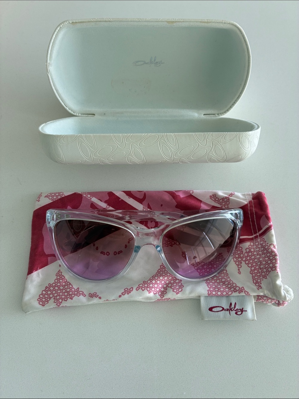 Oakley Clear Frame Cat-Eye Sunglasses with Pink Gradient Lenses